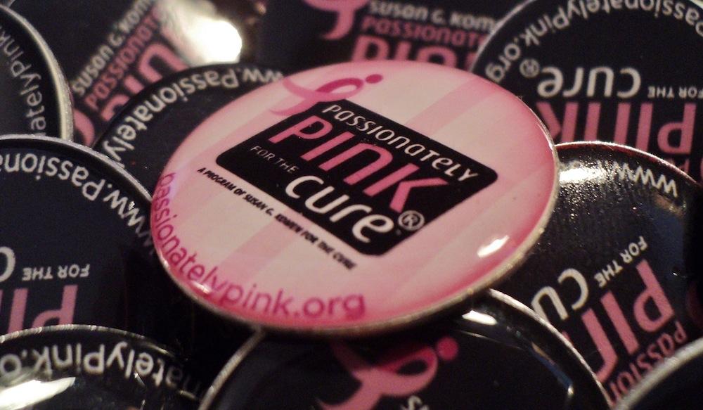 Pink Day pins to support breast cancer awareness. 
