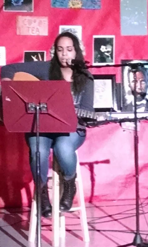 Courtney Gehret performing at Coffeehouse. 