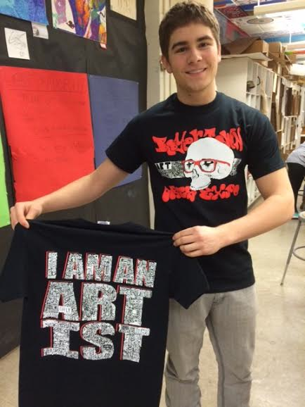 Shirt designer Eric Moore displaying his winning design for the years Arts Expo. 