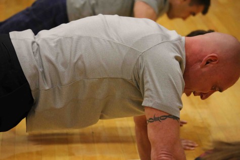 BASH Principal Dr. Brett Cooper participates in the the Veterans Day pushup contest.