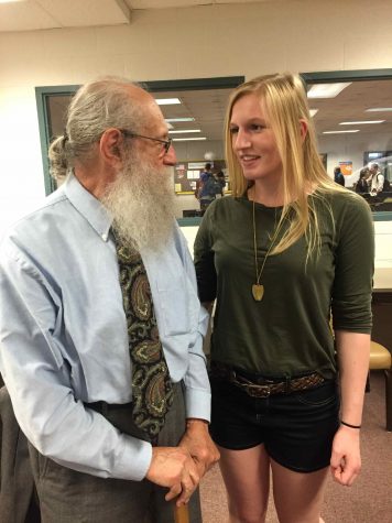 Junior Lauren Moyer talks with Holocaust survivor Joseph Hirt during one of his breakout sessions with students.