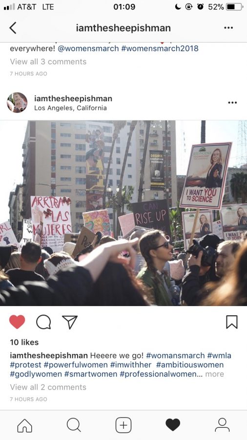 Woman march down California streets with their posters Holland Pettingill