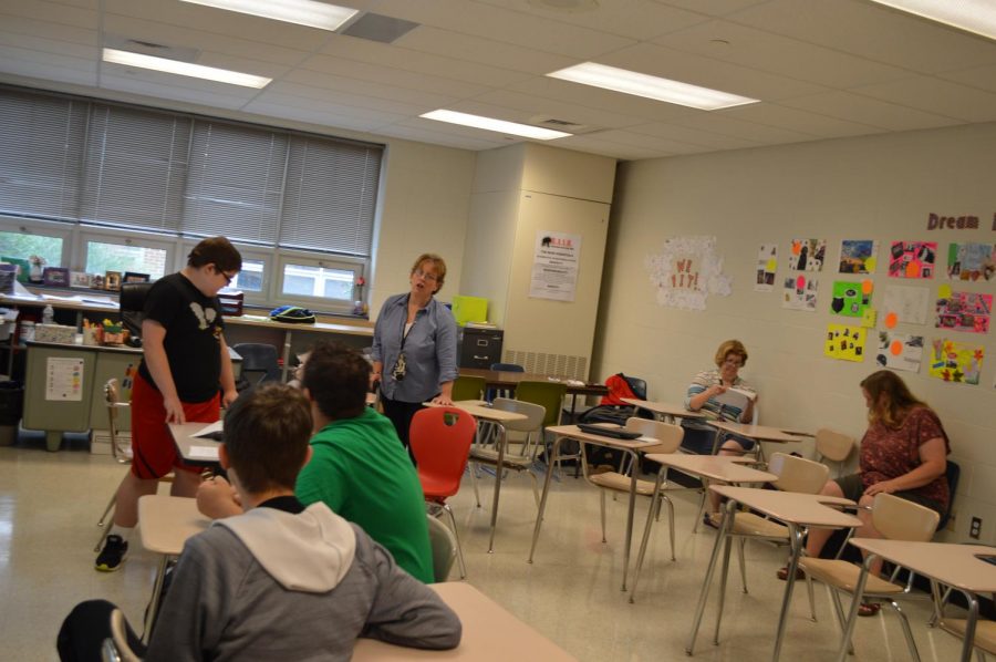 Mrs. Wynands talks with students in her Transition class.