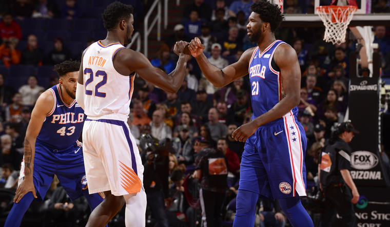 PHOENIX%2C+AZ+-+JANUARY+2%3A+Deandre+Ayton+%2322+of+the+Phoenix+Suns+and+Joel+Embiid+%2321+of+the+Philadelphia+76ers+before+the+game+on+January+2%2C+2019+at+Talking+Stick+Resort+Arena+in+Phoenix%2C+Arizona.+NOTE+TO+USER%3A+User+expressly+acknowledges+and+agrees+that%2C+by+downloading+and+or+using+this+photograph%2C+user+is+consenting+to+the+terms+and+conditions+of+the+Getty+Images+License+Agreement.+Mandatory+Copyright+Notice%3A+Copyright+2019+NBAE+%28Photo+by+Barry+Gossage%2FNBAE+via+Getty+Images%29