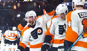 Flyers Claude Giroux, Travis Sanheim, and Sean Couturier celebrate the Flyers 3-2 overtime win vs Boston on Thursday.