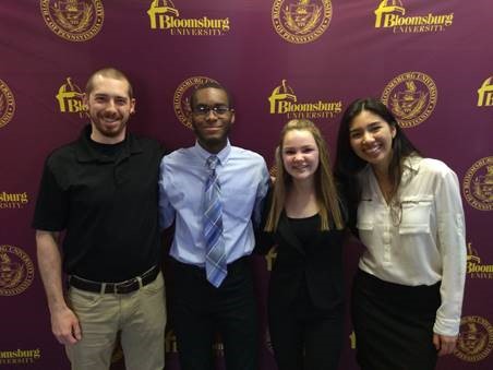 Future Millionaires Club Advisor Mr. Michael Costantino with Ryan Desmornes, Izzy Lodge, and Angelica Le, who participated in a Shark Tank-style competition. 