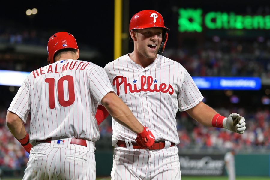 PHILADELPHIA, PA - APRIL 08: Rhys Hoskins #17 of the Philadelphia Phillies gets congratulated by teammate J.T. Realmuto #10 after hitting a home run in the eighth inning against the Washington Nationals at Citizens Bank Park on April 8, 2019 in Philadelphia, Pennsylvania. The Phillies won 4-3. (Photo by Drew Hallowell/Getty Images)