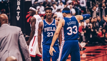 Jimmy Butler and Tobias Harris celebrate the Sixers Game 2 win over Toronto.