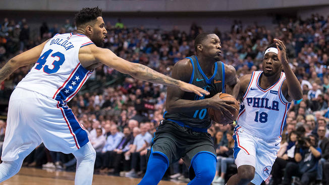 Sixers Jonah Bolden and Shake Milton attempt to defend Mavericks Dorian Finney-Smith in a blowout Sixers loss, 122-102. 