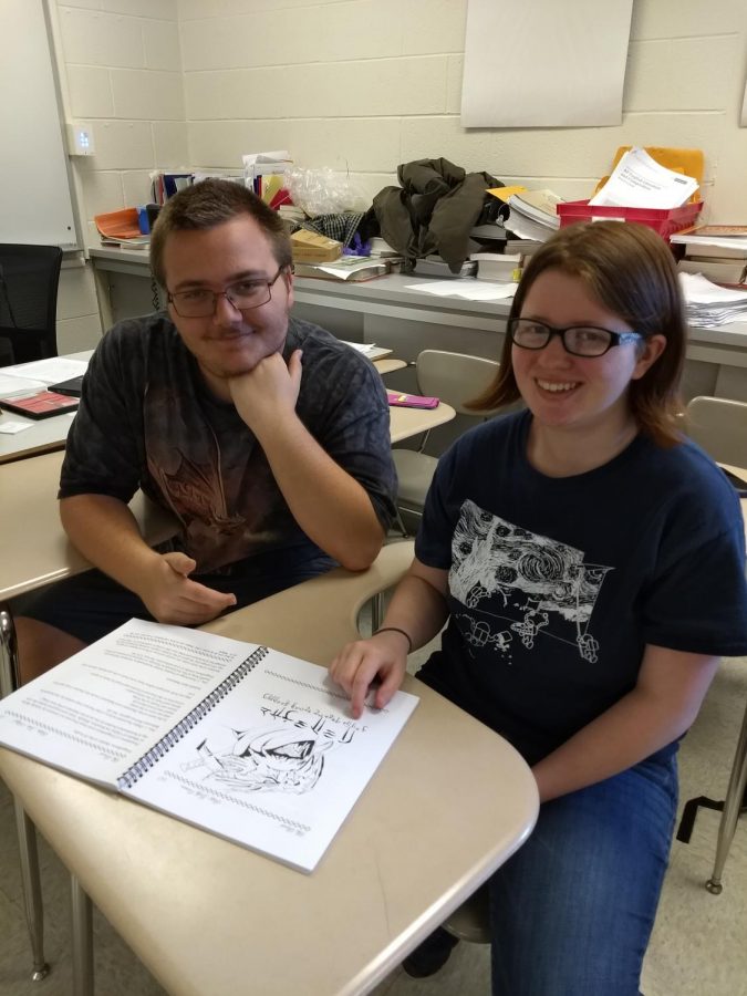 Accent members John Schlegel (left) and Sam Heckler-OConnor (right) looking over final magazine printout.