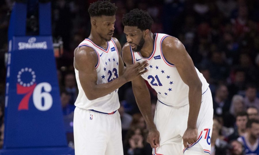 May 5, 2019; Philadelphia, PA, USA; Philadelphia 76ers guard Jimmy Butler (23) talks with center Joel Embiid (21) during the third quarter in game four of the second round of the 2019 NBA Playoffs against the Toronto Raptors at Wells Fargo Center. Mandatory Credit: Bill Streicher-USA TODAY Sports ORG XMIT: USATSI-403568 ORIG FILE ID:  20190505_szo_sq4_0218.JPG