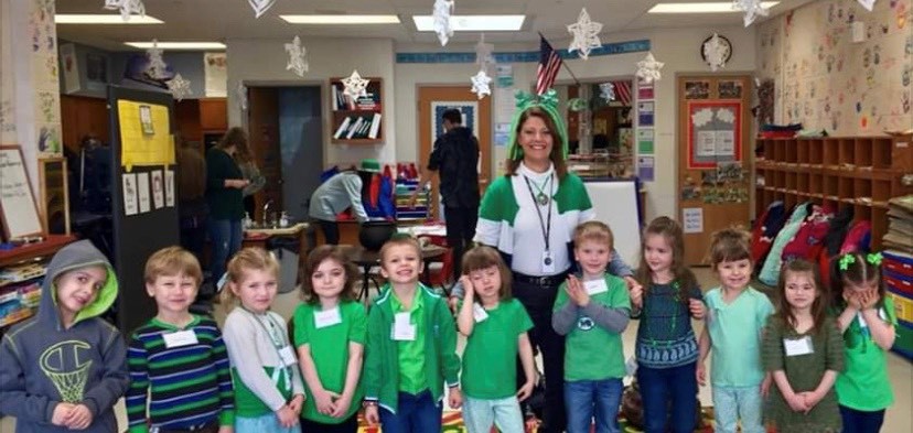 Mrs. Pam Yanusko, who will retire at the end of this year, with children in the Preschool program.