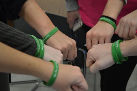 Students wear bracelets with the messages Mental Health Matters and You Are Not Alone for Mental Health Awareness Day. Bracelets were provided by SADD to every student in the building.
