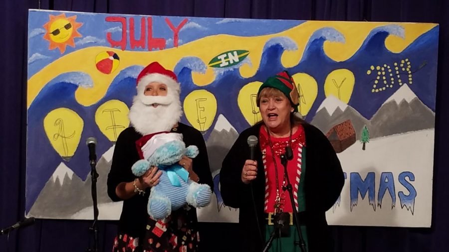 Mrs. Hoffman and Mrs. Shumock performing Hippopotamus for Christmas, during the staff karaoke contest.