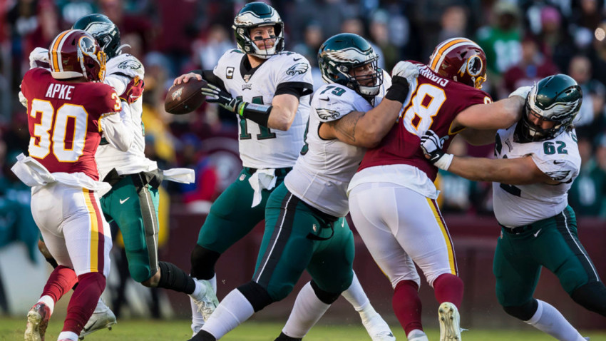 LANDOVER, MD - DECEMBER 15: Carson Wentz #11 of the Philadelphia Eagles attempts a pass against the Washington Redskins during the first half at FedExField on December 15, 2019 in Landover, Maryland. (Photo by Scott Taetsch/Getty Images)