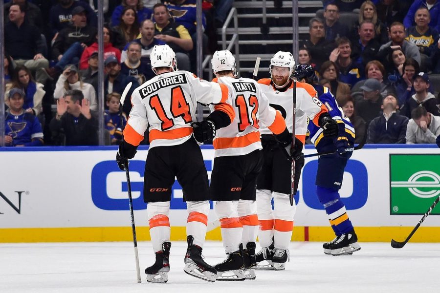 Flyers Jakub Voracek is greeted by teammates Sean Couturier and Michael Raffl after scoring the game winning goal in overtime as the Flyers beat the Blues 4-3 on Wednesday.