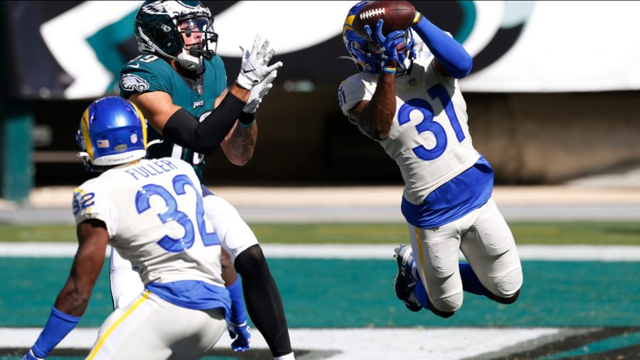 Rams cornerback, Troy Hill, intercepts a pass thrown by Eagles quarterback, Carson Wentz.