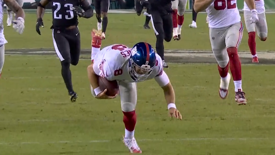 Giants quarterback, Daniel Jones, trips and falls running down the field trying to run for a touchdown against the Eagles on Thursday Night Football.