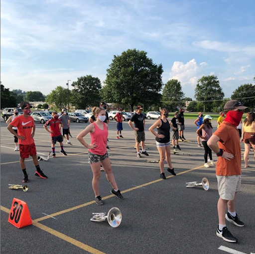 BASH marching unit warming up during band camp