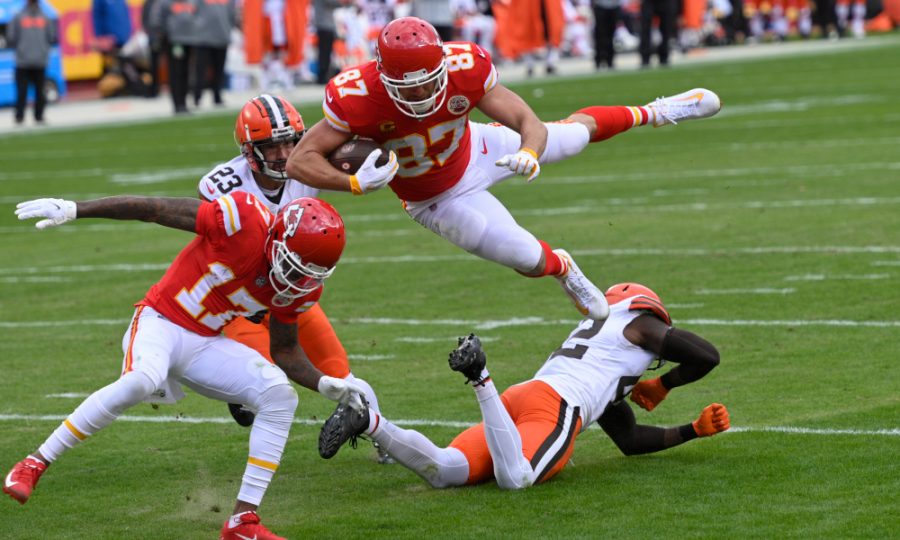 Kansas City Chiefs tight end Travis Kelce (87) leaps over Cleveland Browns safety Karl Joseph, right, during a 20-yard touchdown reception in the first half of an NFL divisional round game against the Cleveland Browns