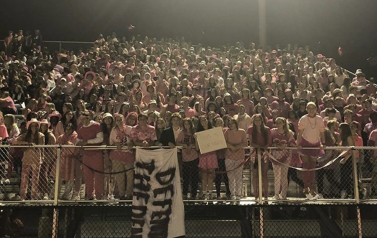 The Homecoming student section dressed to support breast cancer awareness during Pink Out