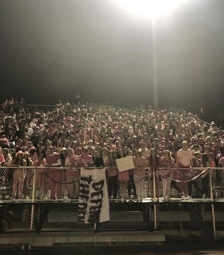 Last years Homecoming student section dressed supporting Breast Cancer awareness for pink-out!