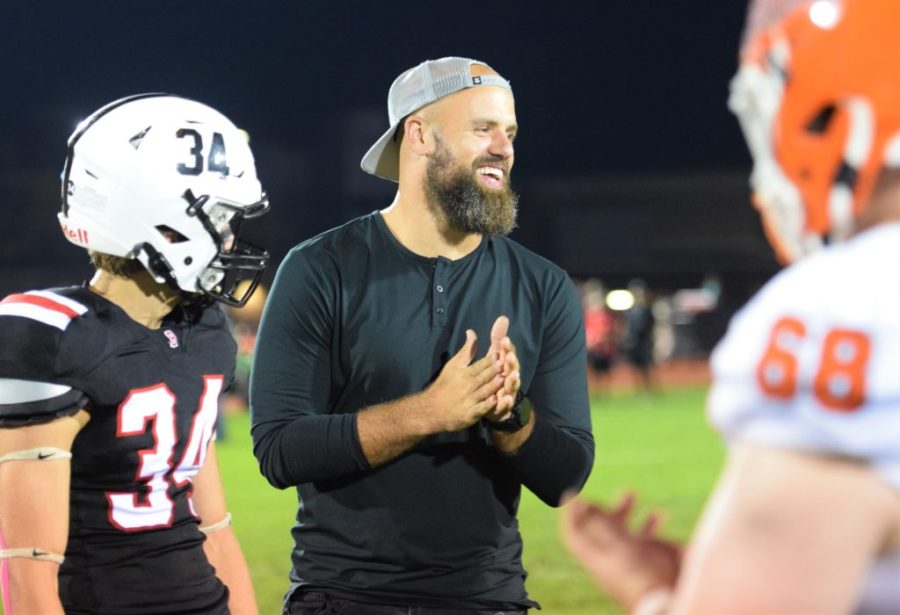 Former Boyertown high school football player, and three time Super Bowl champion with the New England Patriots, smiling during the captains meeting, as he was the honorary captain for the game. 