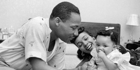 MONTGOMERY, AL - MAY 1956: Civil rights leader Reverend Martin Luther King, Jr. relaxes at home with his wife Coretta and first child Yolanda in May 1956 in Montgomery, Alabama. 