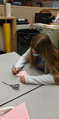 Student Council member Autumn Nuss working on hearts