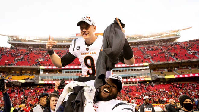 Cincinnati Bengals defensive tackle, Tyler Shelvin, carries quarterback Joe Burrow on his shoulder after 27-24 win over the Kansas City Chiefs in the AFC Championship game. Burrow and Shelvin were also former teammates back at LSU, and recreated the picture just like the one taken when they won the National Title.