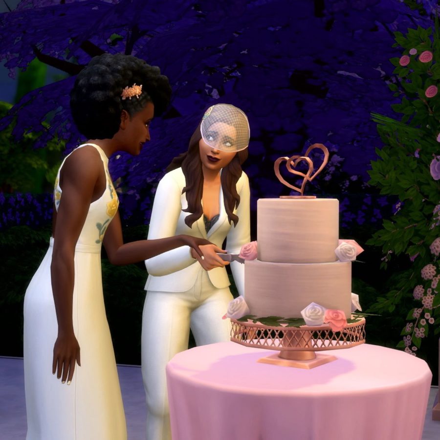 The two Sims characters, Dominique and Camille, cutting a wedding cake together. 