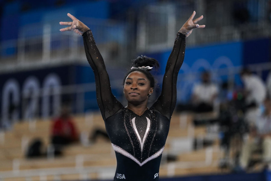 Simone Biles performing on balance beam at the 2020 Summer Olympics in Tokyo, Japan.