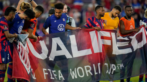 U.S Mens National Team players holding a qualified banner after defeating Costa Rica 5-1 at home.