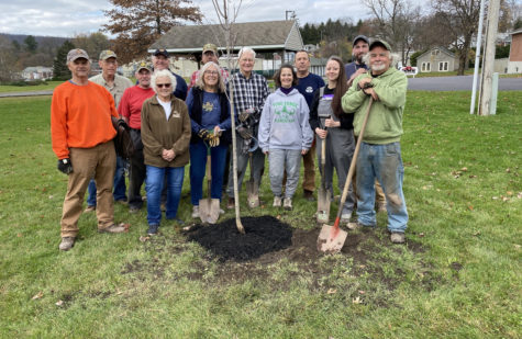 Volunteers from Building a Better Boyertown and the Boyertown Masonic Lodge pose in front of the tree they planted