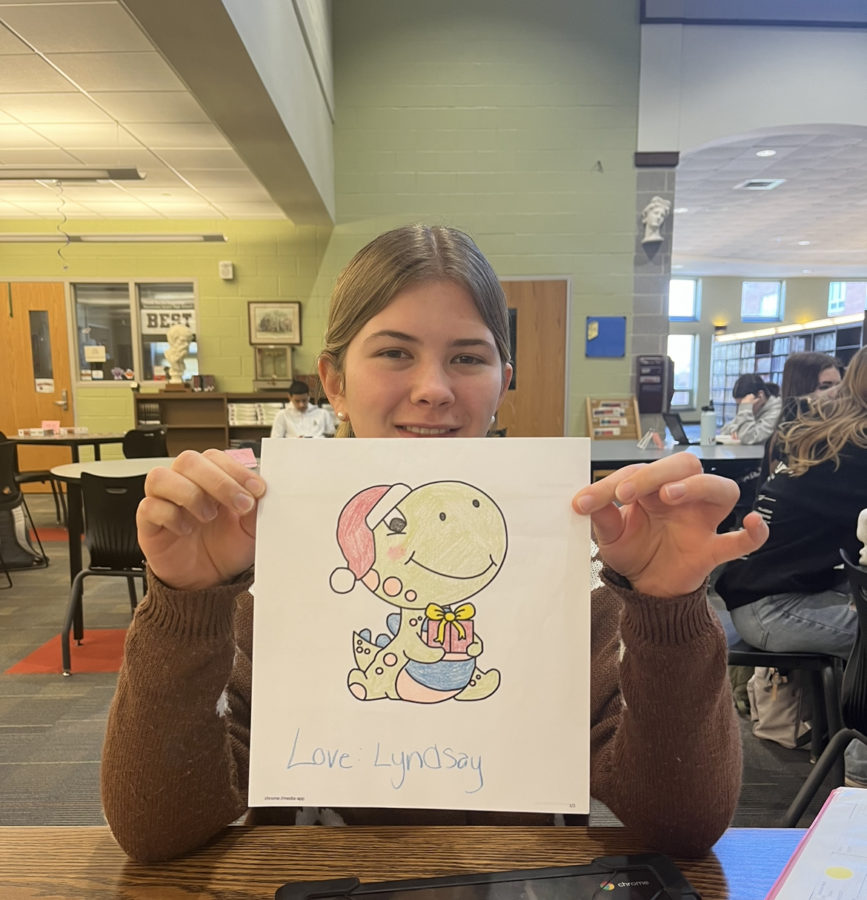 BASH student Autumn Nuss posing with a homemade Valentines Day gift. 