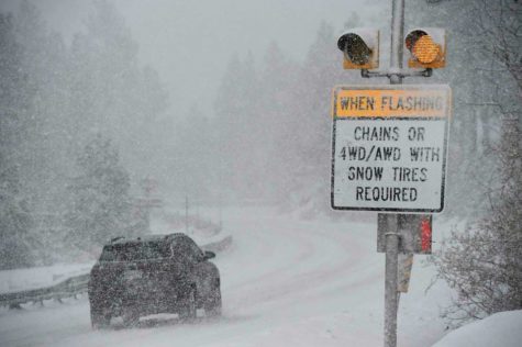 Car tries to drive through snowstorm in california. 
