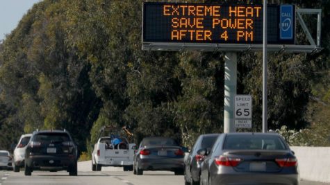 A sign along Interstate 580 West warns of excessive heat in Oakland, California, from Sept. 6, 2022.