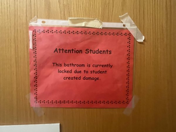 Sign hanging outside the boys 800s bathroom, currently closed.