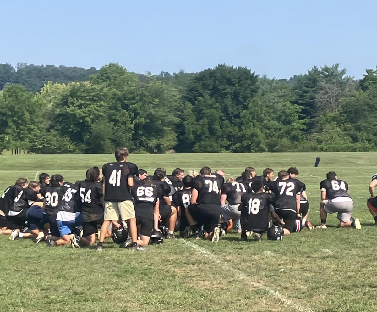 Football team taking a knee