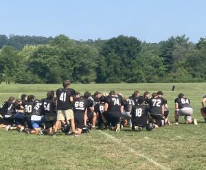 Football team taking a knee