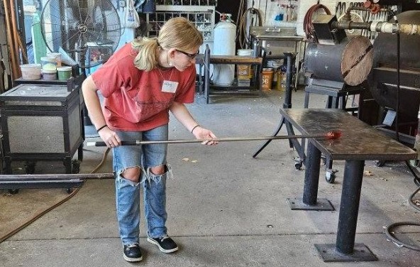 Hailey Gress, BASH Cub Correspondent, taking her glass blowing class at Taylor Backes. 