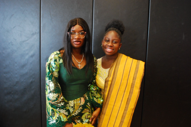 Two students with traditional Nigerian outfits