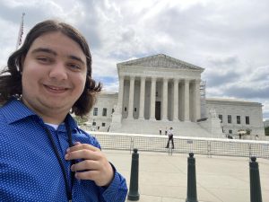 Ethan in front of the Supreme Court during the 2024 Washington Youth Summit on the Environment.