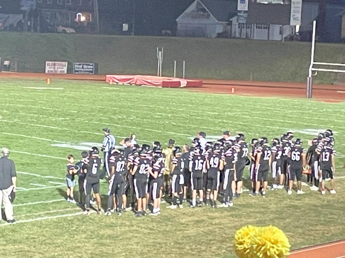 The BASH Football team on the sidelines