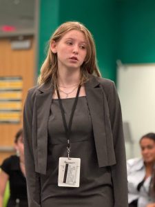 Hailey Gress speaking in WJMC meeting