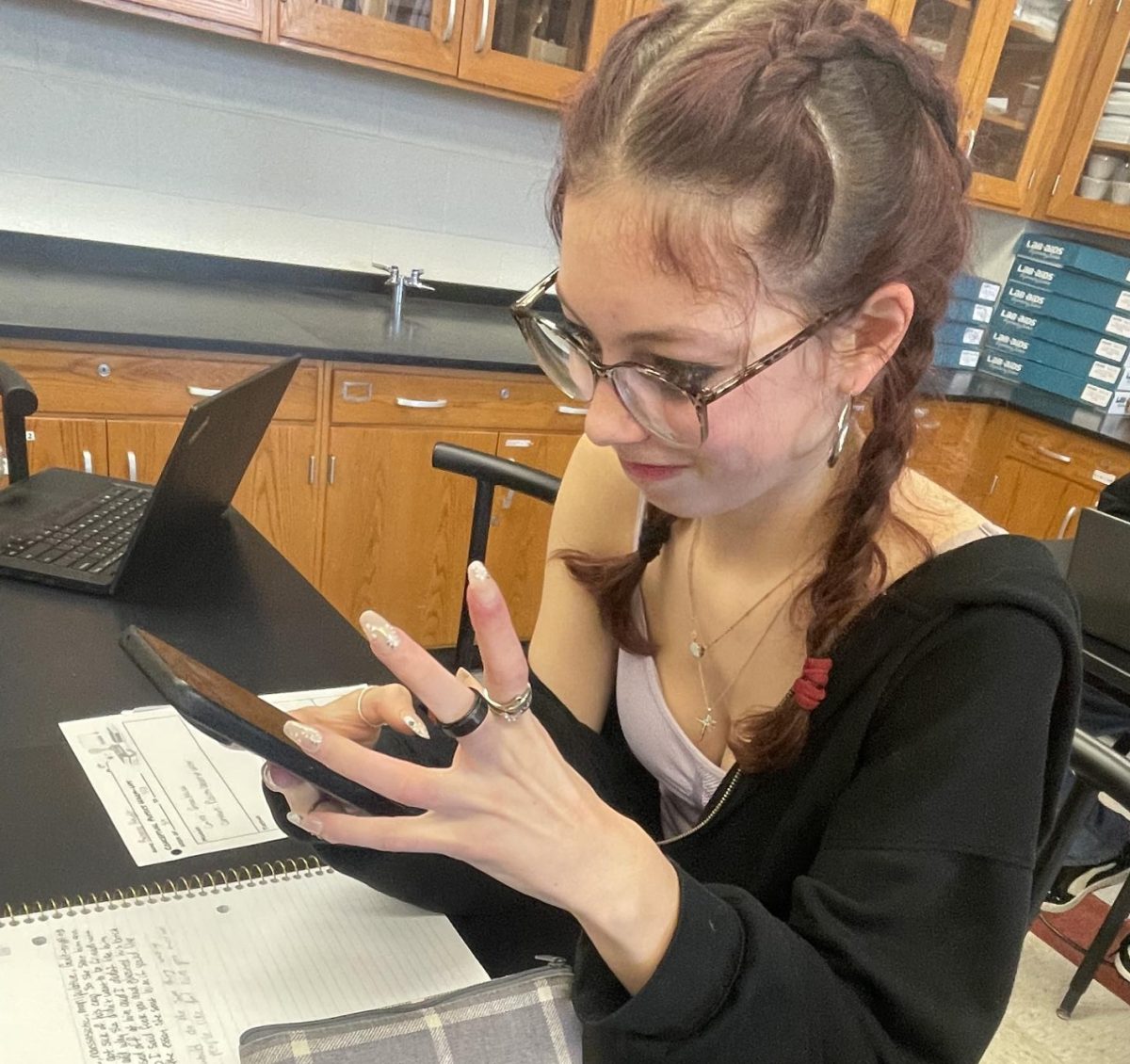 BASH student angrily staring at their phone