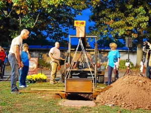 (1966 time capsule being dug up by the mayor)