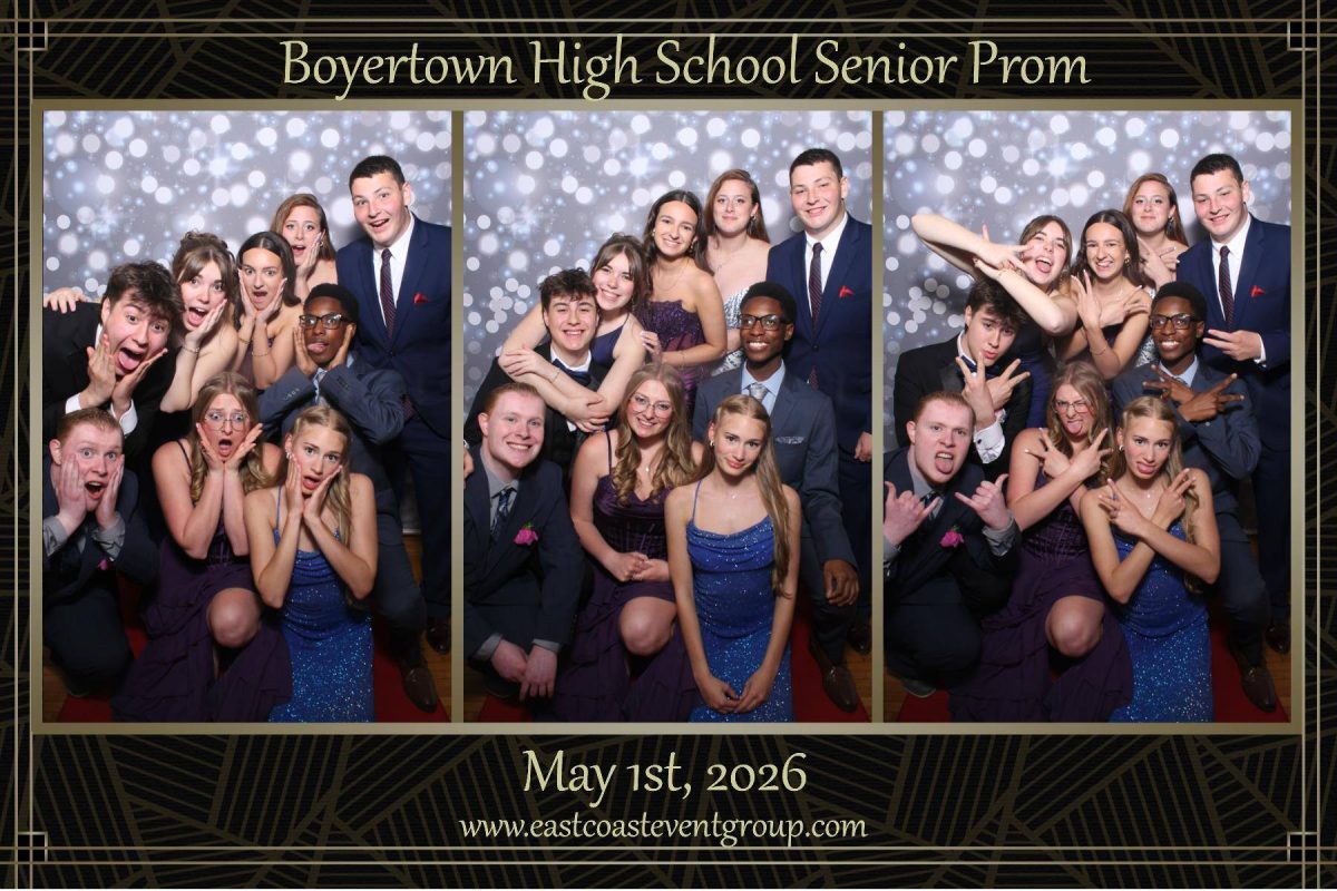 A group of friends at the photobooth during Prom