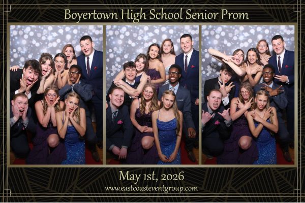 A group of friends at the photobooth during Prom